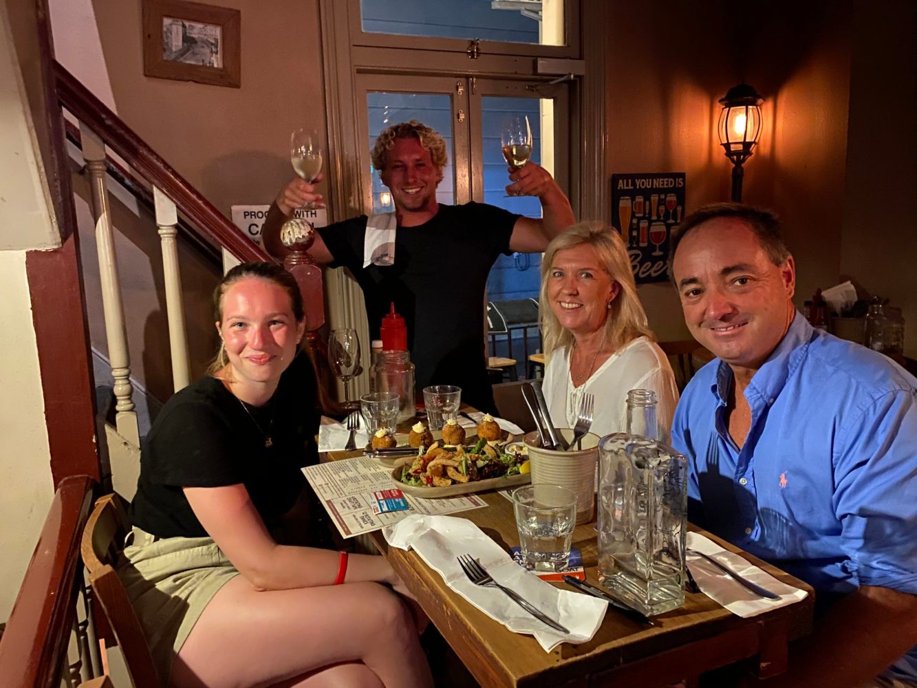 a group of people sitting at a table