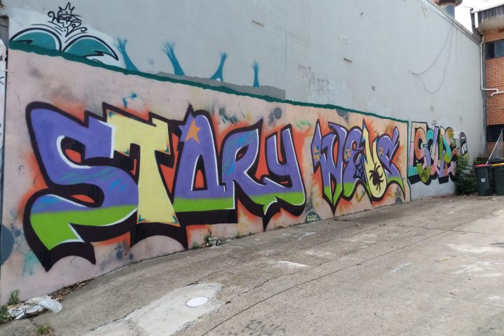 colorful graffiti on the side of a building