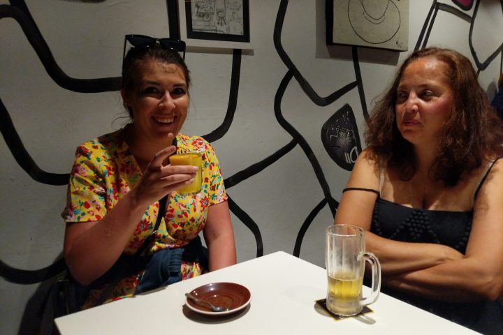 a couple of people that are sitting on a table