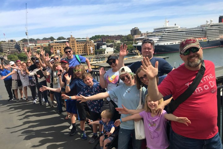 a group of people standing in front of a crowd