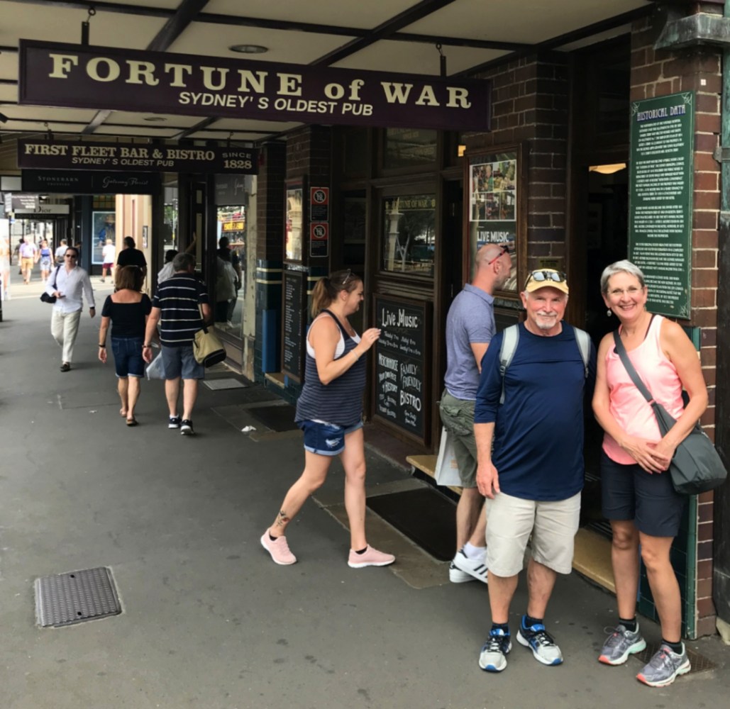 a group of people standing in front of a building