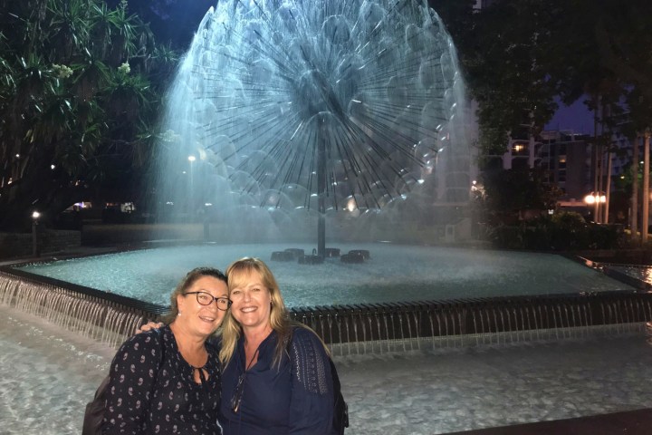 a man sitting in front of water