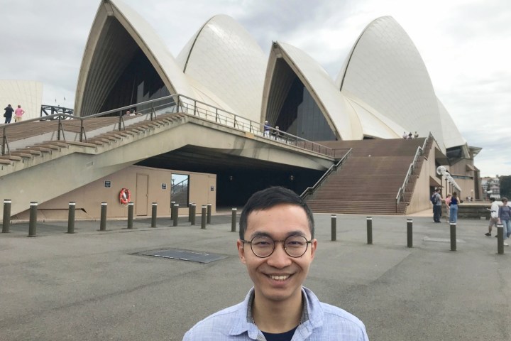 a man wearing sunglasses posing for the camera