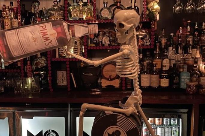 David Bowie standing in front of a store