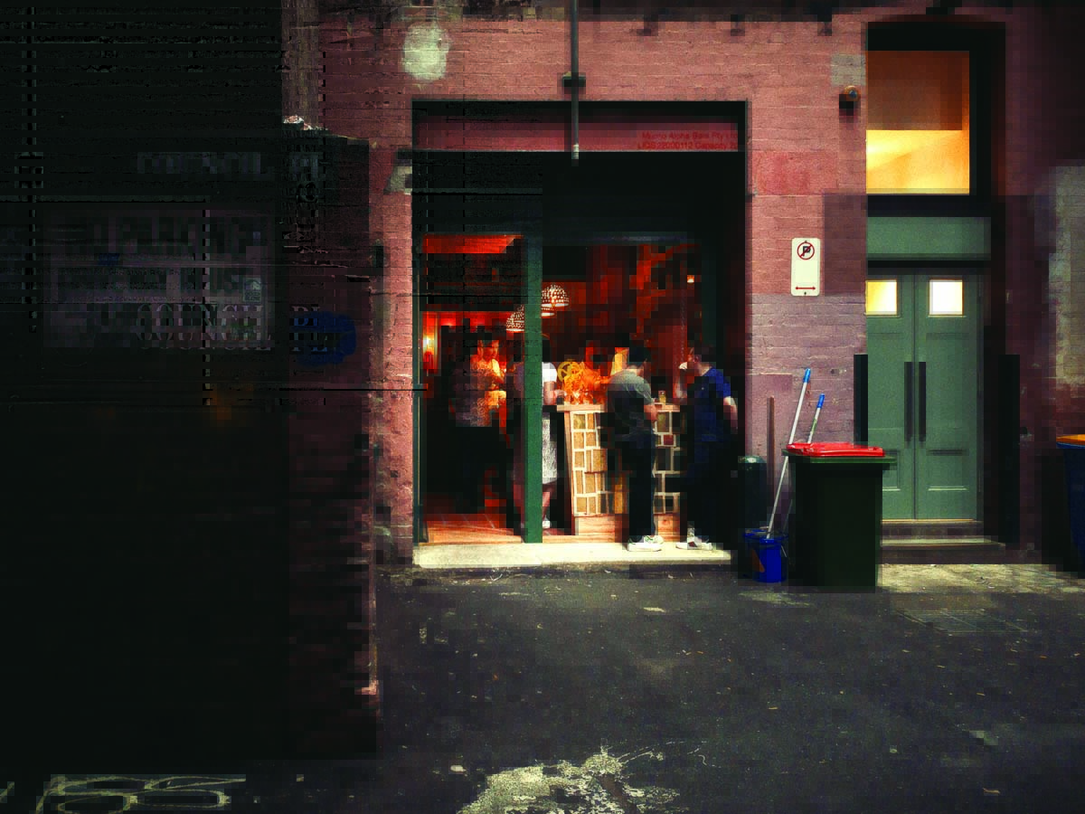 Cantina-OK-Exterior-APC_0016_79d4b9a93d9f492cbc4277c937f3c4ff a person standing in front of a brick building