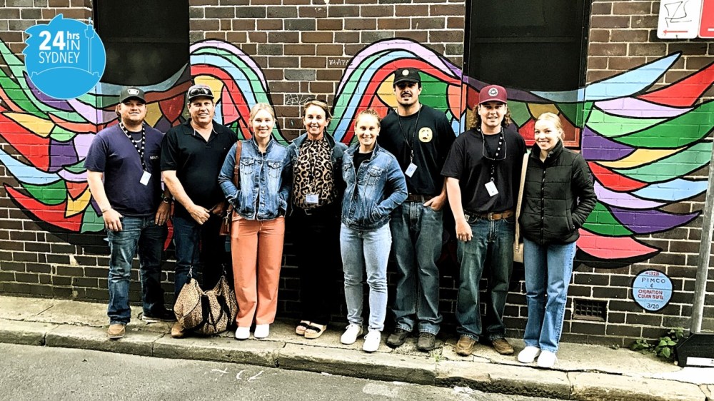 a group of people standing in front of a building