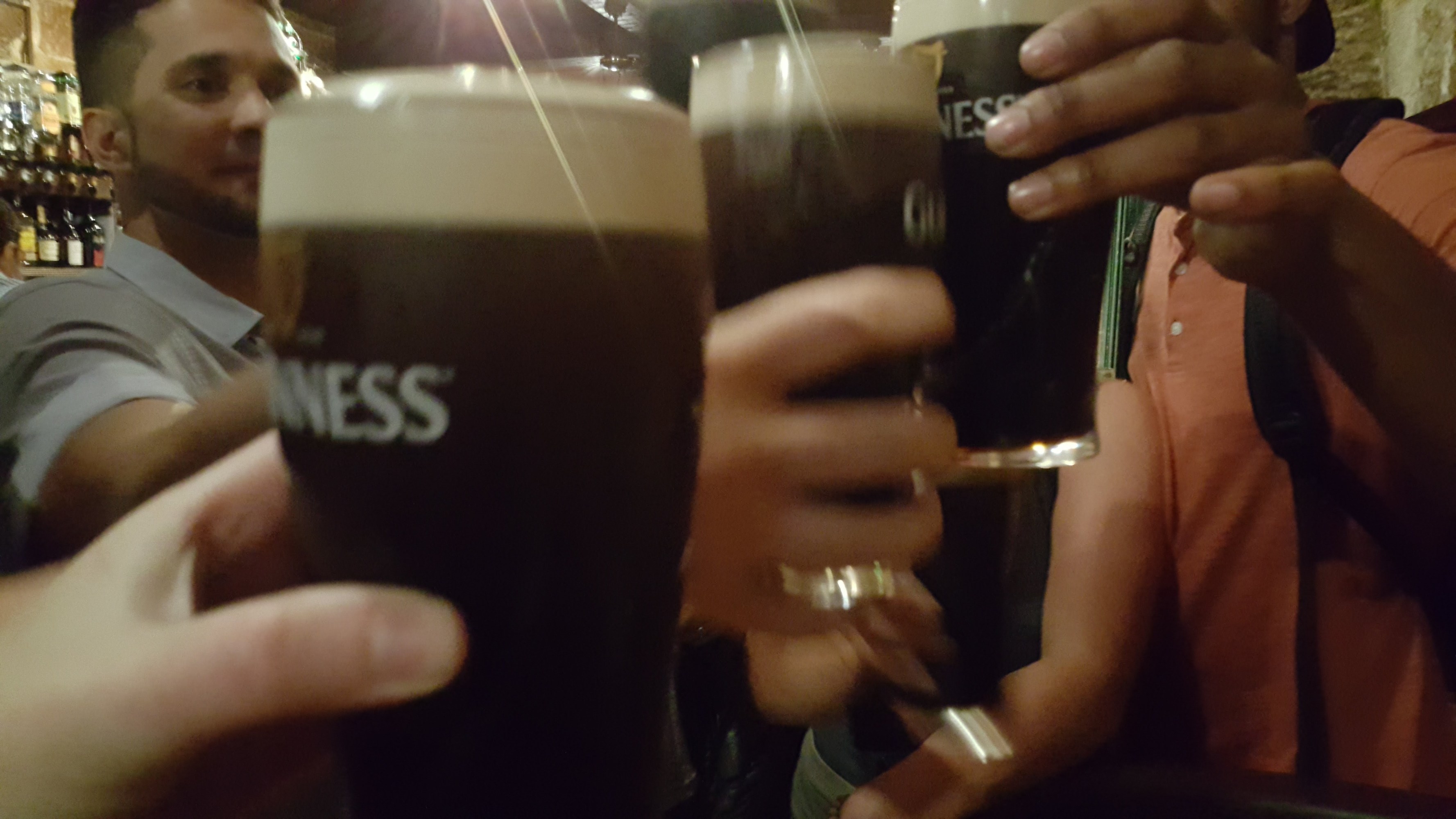 a hand holding a glass of wine