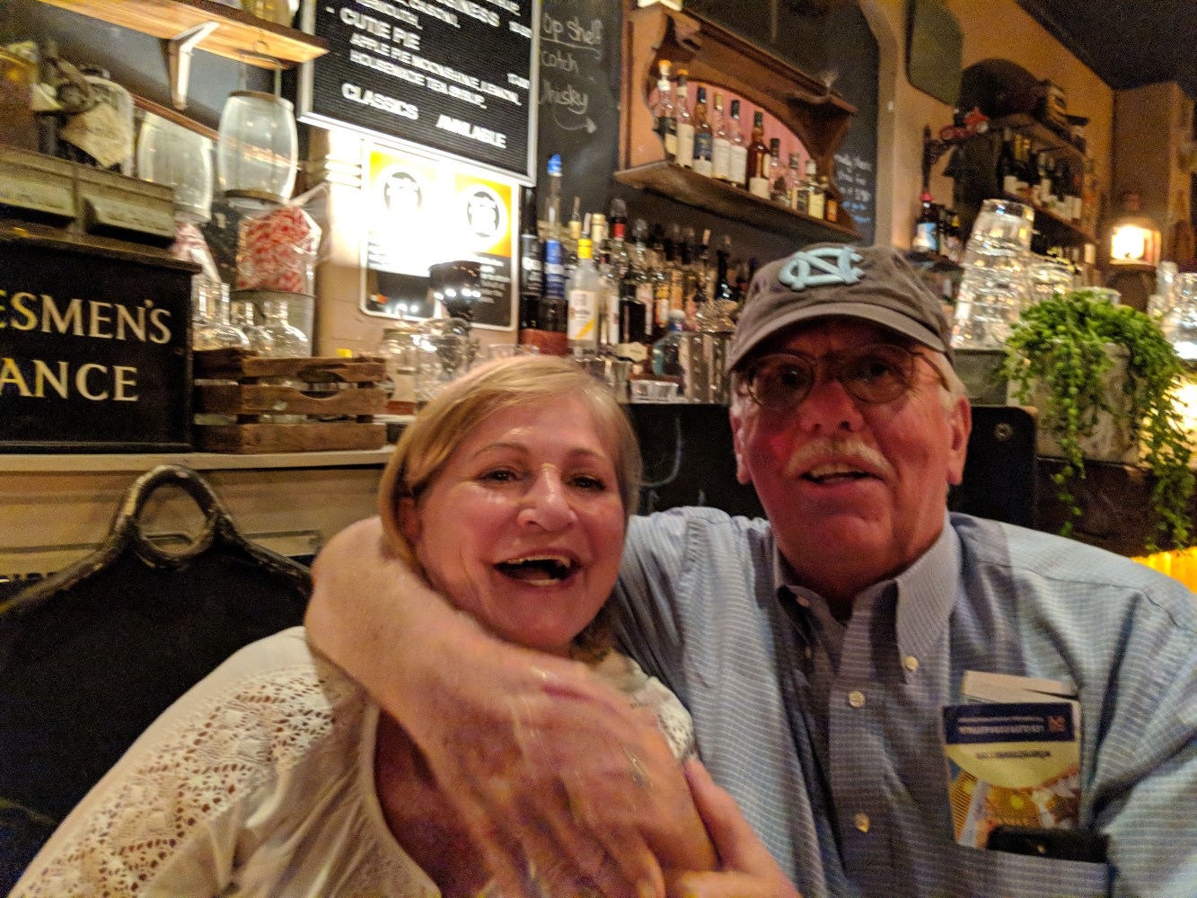 Couple in front of bar