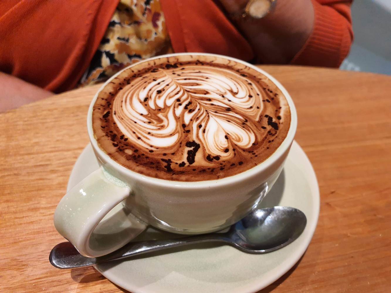 a cup of coffee on a table