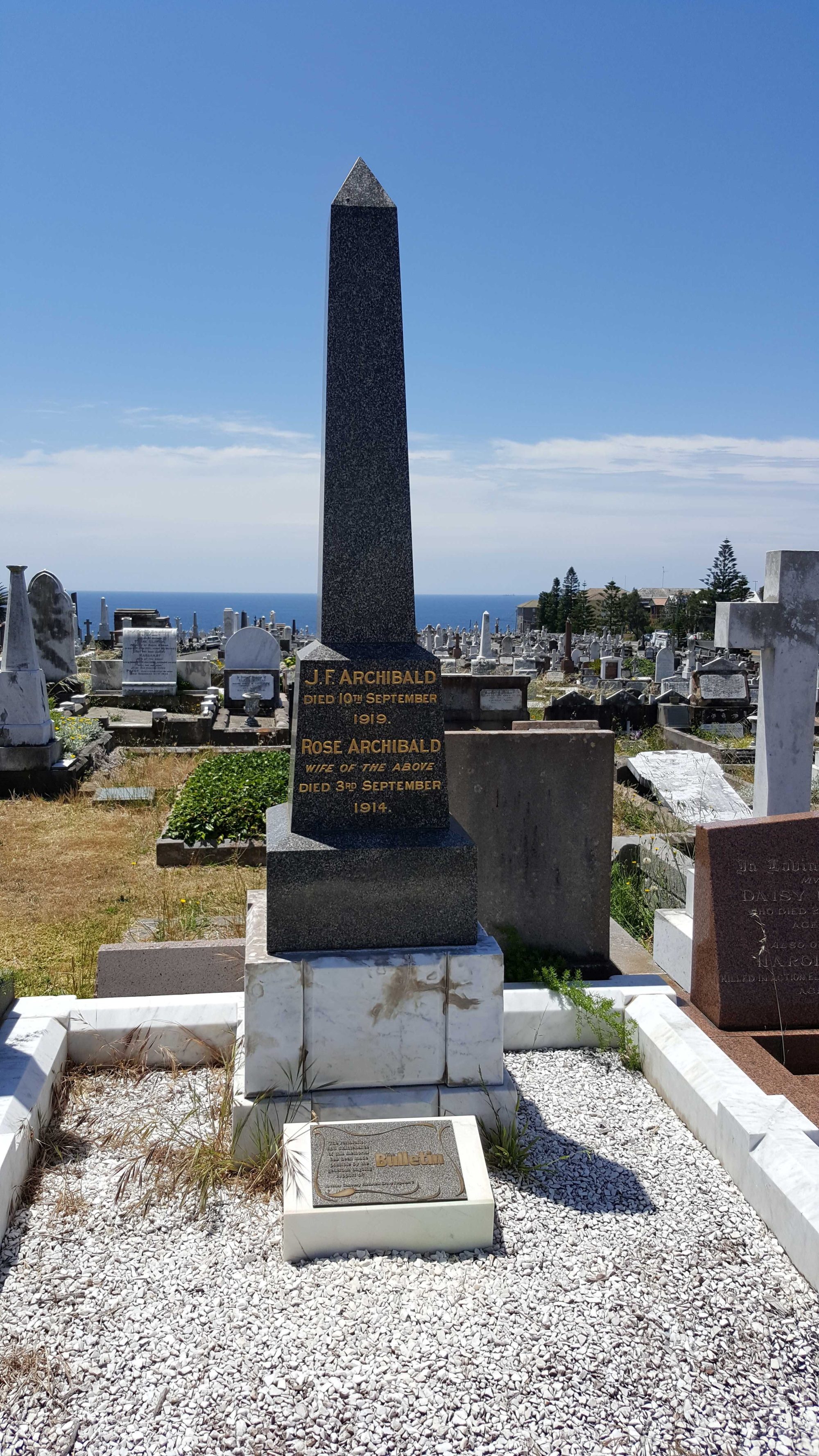 JF Archibald Waverly Cemetery a stone bench sitting next to a building