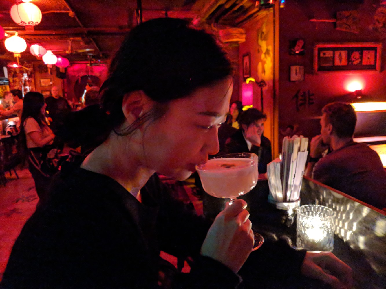 a lady sitting at a table in a restaurant